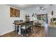 Farmhouse dining table with four chairs in bright dining area at 2222 Andover Cir, Palm Harbor, FL 34683