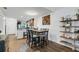 Dining area with table and chairs next to kitchen at 2222 Andover Cir, Palm Harbor, FL 34683