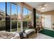 Relaxing sunroom with plenty of natural light and seating at 2222 Andover Cir, Palm Harbor, FL 34683