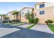Tan townhouses with garages, paved driveways, and landscaping at 5614 Red Snapper Ct, New Port Richey, FL 34652