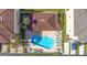 Community pool with surrounding lounge chairs at 5614 Red Snapper Ct, New Port Richey, FL 34652