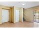 Clean basement entry with storage and access to the backyard at 5614 Red Snapper Ct, New Port Richey, FL 34652