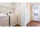 Laundry room with washer, dryer, and shelving at 5614 Red Snapper Ct, New Port Richey, FL 34652