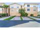 Three-unit building with garages and landscaping at 5614 Red Snapper Ct, New Port Richey, FL 34652