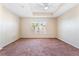 Spacious bedroom with carpeted floors and large window at 5614 Red Snapper Ct, New Port Richey, FL 34652