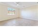 Spacious bedroom with tile flooring and a ceiling fan at 5614 Red Snapper Ct, New Port Richey, FL 34652
