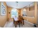 Charming dining room with wood table and chairs, plus an arched window at 8233 Danubian Pl, Trinity, FL 34655