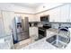 Modern kitchen with stainless steel appliances and granite countertops at 4516 Seagull Dr # 414, New Port Richey, FL 34652