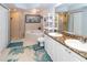 Elegant bathroom with double sinks, soaking tub, and shower at 4516 Seagull Dr # 414, New Port Richey, FL 34652