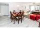Bright dining area with hardwood floors, chandelier, and seating for six at 4516 Seagull Dr # 414, New Port Richey, FL 34652