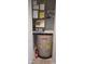 Storage closet with water heater and AC unit at 4516 Seagull Dr # 414, New Port Richey, FL 34652