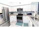 Modern kitchen with stainless steel appliances and granite countertops at 4516 Seagull Dr # 414, New Port Richey, FL 34652
