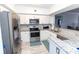 Modern kitchen with stainless steel appliances and granite countertops at 4516 Seagull Dr # 414, New Port Richey, FL 34652