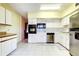 Well-lit kitchen featuring stainless steel appliances and ample cabinetry at 2430 Florentine Way # 8, Clearwater, FL 33763