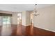 Spacious dining room with hardwood floors and chandelier at 6335 Cardinal Crest Dr, New Port Richey, FL 34655