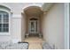 Elegant entryway with arched detail and decorative glass door at 6335 Cardinal Crest Dr, New Port Richey, FL 34655