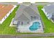 Aerial view showing home, pool, and landscaping at 6335 Cardinal Crest Dr, New Port Richey, FL 34655