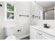 Modern bathroom with white vanity and walk-in shower at 12119 Landfair St, Spring Hill, FL 34608