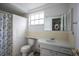 Bright bathroom with a shower/tub combination, a toilet, and a sink at 12307 Fieldstone Ln, Hudson, FL 34667