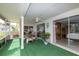 Comfortable screened lanai offers outdoor dining, a convenient serving bar, and easy access to the Primary bedroom at 12307 Fieldstone Ln, Hudson, FL 34667