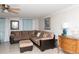 Cozy living room features a large sectional sofa, tile floors and comfortable seating at 12307 Fieldstone Ln, Hudson, FL 34667