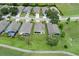 An aerial view showcasing a community of single-Gathering homes at 11724 Heritage Point Dr, Hudson, FL 34667