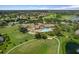 Aerial view of community clubhouse, pool, and golf course at 11724 Heritage Point Dr, Hudson, FL 34667