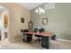 Home office with built-in desk and view of the backyard at 11724 Heritage Point Dr, Hudson, FL 34667
