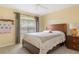 Spacious bedroom with ample natural light and a ceiling fan at 11724 Heritage Point Dr, Hudson, FL 34667