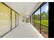 Screened porch overlooking a lush green space at 5060 Secretariat Run, Spring Hill, FL 34609