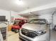 Garage with space for a car and golf cart at 18937 Grand Club Dr, Hudson, FL 34667