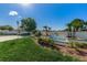 Community entrance with fountain and lush landscaping at 2522 Pine Ridge S Way # A2, Palm Harbor, FL 34684