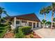 Community clubhouse with pool view and picnic area at 2522 Pine Ridge S Way # A2, Palm Harbor, FL 34684