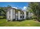Condo building with multiple units and a parking lot at 2522 Pine Ridge S Way # A2, Palm Harbor, FL 34684