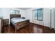 Spacious bedroom with wood flooring and large window at 2522 Pine Ridge S Way # A2, Palm Harbor, FL 34684
