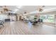 Community room with tables, chairs and game tables at 2522 Pine Ridge S Way # A2, Palm Harbor, FL 34684