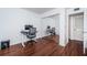 Home office with wood floors, mirrored closet and a standing desk at 2522 Pine Ridge S Way # A2, Palm Harbor, FL 34684
