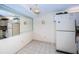 Small dining area adjacent to kitchen with mirrored wall at 2522 Pine Ridge S Way # A2, Palm Harbor, FL 34684