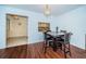 Dining area with table and chairs, and view to kitchen at 2522 Pine Ridge S Way # A2, Palm Harbor, FL 34684
