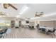 Community room with seating, tables, and game tables at 2522 Pine Ridge S Way # A2, Palm Harbor, FL 34684