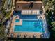 Overhead view of community pool and spa at 2522 Pine Ridge S Way # A2, Palm Harbor, FL 34684