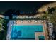 Community pool with lake view at 2522 Pine Ridge S Way # A2, Palm Harbor, FL 34684