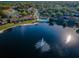 Aerial view of community pool and lake at 2522 Pine Ridge S Way # A2, Palm Harbor, FL 34684