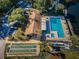 Community pool, clubhouse, and shuffleboard at 2522 Pine Ridge S Way # A2, Palm Harbor, FL 34684