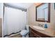 Clean bathroom with shower/tub combo and granite vanity at 2522 Pine Ridge S Way # A2, Palm Harbor, FL 34684