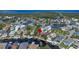 Aerial view of waterfront home in a residential community at 6316 Spoonbill Dr, New Port Richey, FL 34652