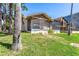 Back of house with screened porch at 6316 Spoonbill Dr, New Port Richey, FL 34652