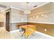 Simple dining area with drop leaf table and light fixture at 6316 Spoonbill Dr, New Port Richey, FL 34652