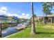 Stunning view of canal with boats and neighboring properties at 6316 Spoonbill Dr, New Port Richey, FL 34652