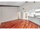 Hardwood floors and wood beam accents in this open living area at 302 Leafwood Rd, Tarpon Springs, FL 34689